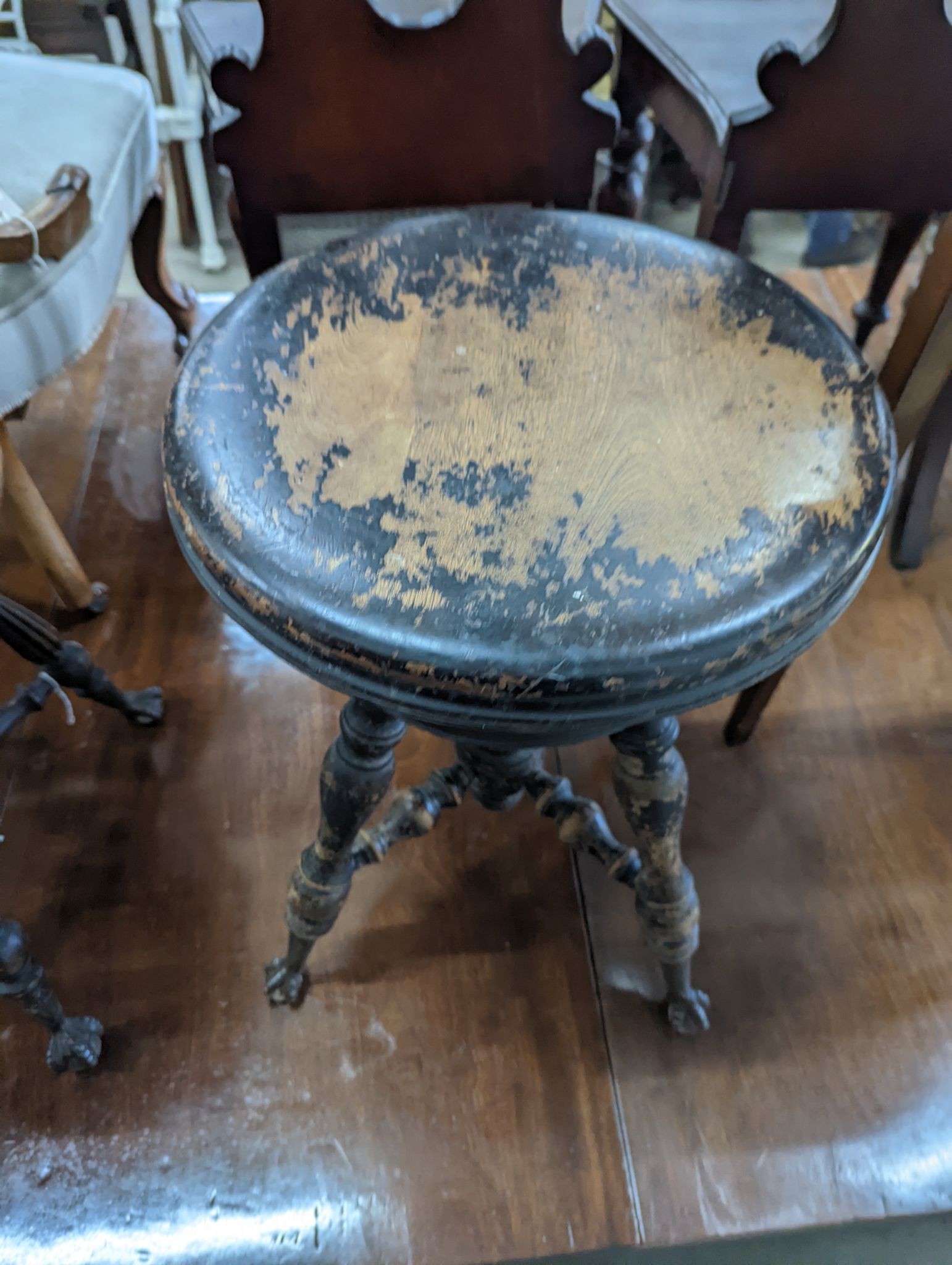 A near pair of Victorian mahogany and beech adjustable stools with revolving seats, larger diameter 36cm